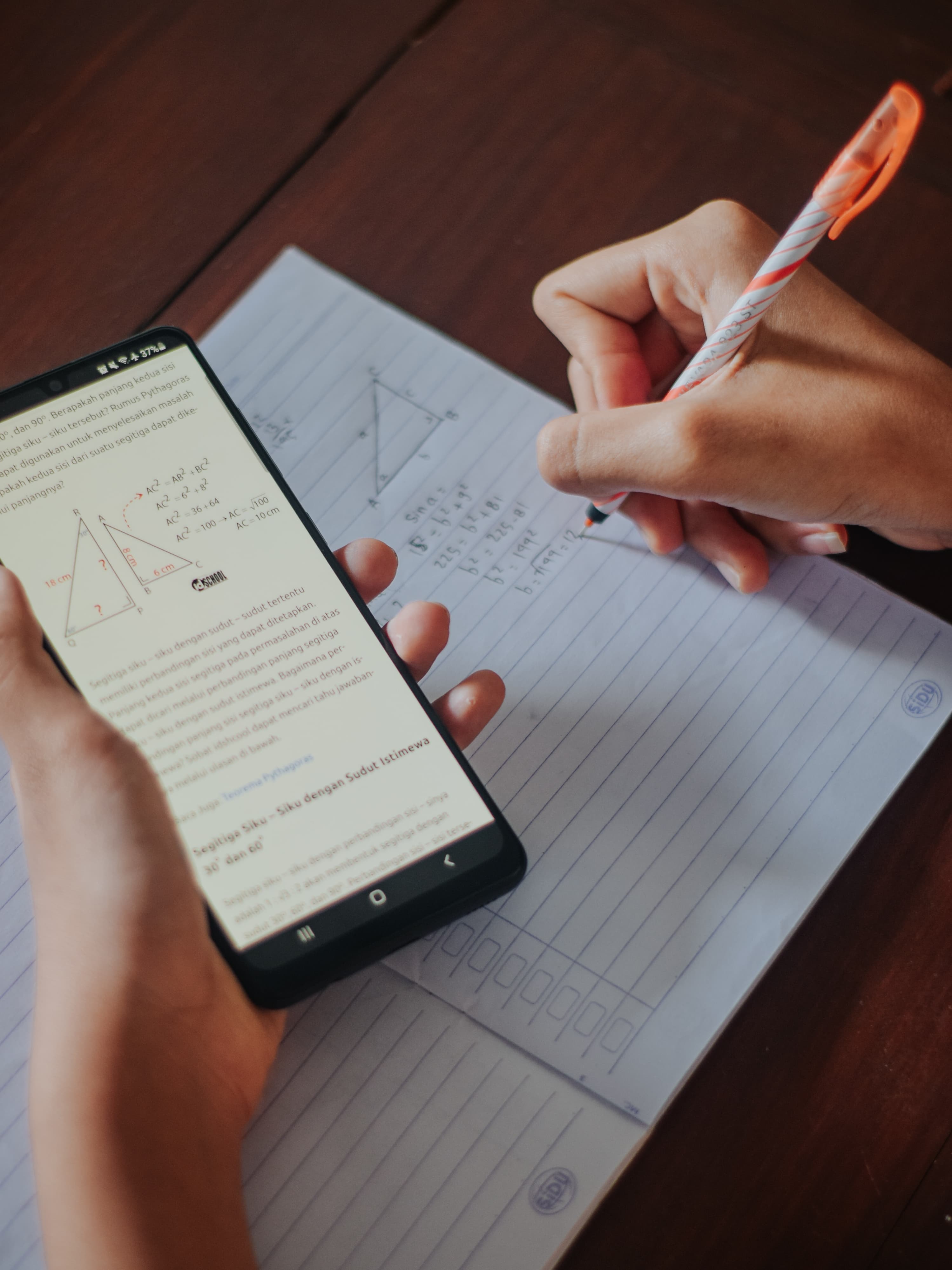 Student writing math by hand